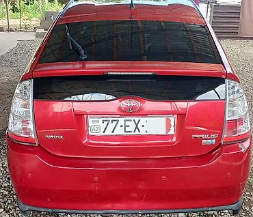 pirus disk: Toyota Prius (2-ci nəsil) – qırmızı rəngdə hibrid hetçbek. Salam — 3