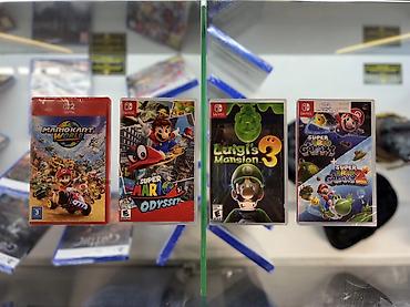 Картриджи игр для Nintendo Switch (в коробках): - Mario Kart World —