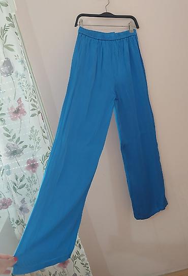 Personal Items: Ženske pantalone širokog kroja u intenzivnoj tirkizno-plavoj boji. - — 2