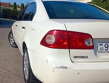 90 fa 373: Kia Optima: 2.7 l | 2008 il Sedan — 4