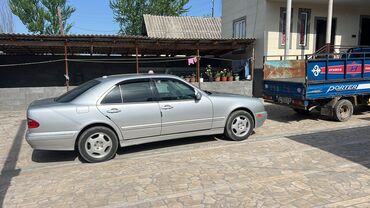домкрат w210: Mercedes-Benz E‑Class W210, серебристый седан. Ключевые особенности