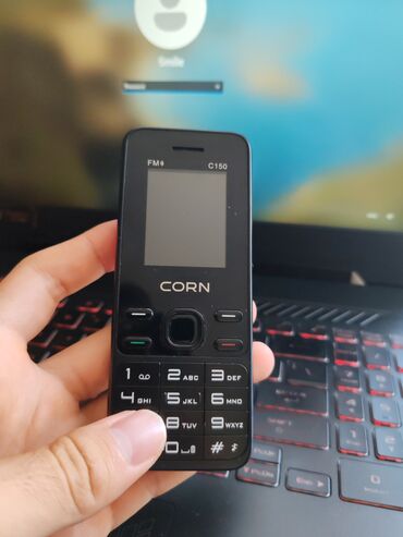 fm radio: CORN C150 modeli qara rəngdə, FM radiolu və kamera funksiyalı kiçik