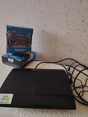 ps 3 cd: Sony PlayStation 3 Super Slim konsolu + 2 ədəd DualShock 3 simsiz pult — 3