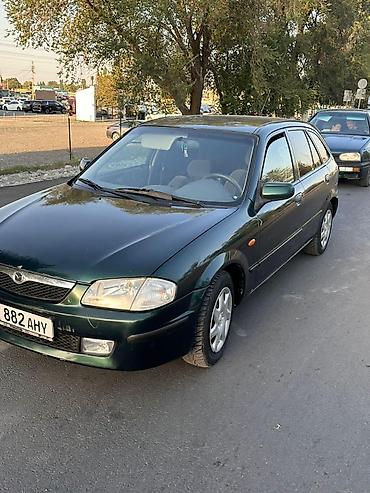 daf 95 480: Mazda 323: 2000 г., 1.6 л, Механика — 1