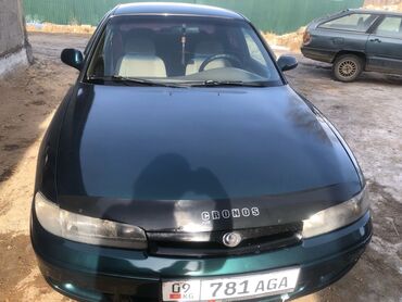 гибридные авто: Mazda 626: 1995 г., 2 л, Механика, Бензин, Седан