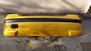 бампер на 210 кузов: Задний Бампер Hyundai Б/у, цвет - Желтый