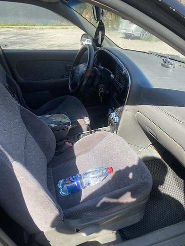 Другие автомобили: Седан компакт-класса, 4 двери, темно‑зеленый/черный цвет. Киргизские — 7