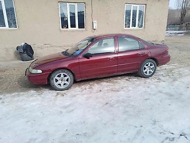 мото каракол: Ford : 1995 г., 2 л, Кол менен иштөөчү, Бензин, Седан — 1