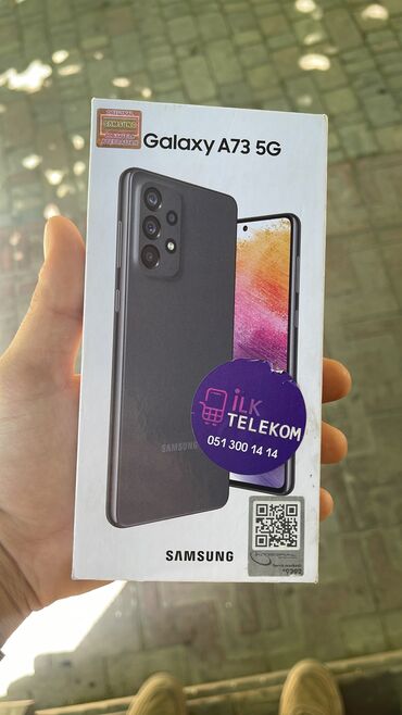 флай тонкий телефон: Samsung Galaxy A73 5G, 128 ГБ, цвет - Серый, Отпечаток пальца, Беспроводная зарядка, Face ID
