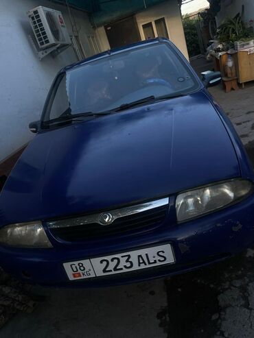 авто российской номерами: Mazda : 1.5 л, Механика, Бензин, Купе