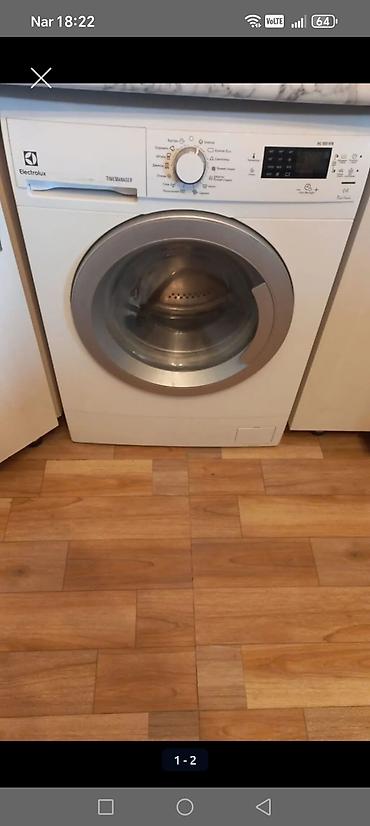 15 pro titanium: Electrolux markalı ön yükləməli paltaryuyan maşın. Model panelində — 1