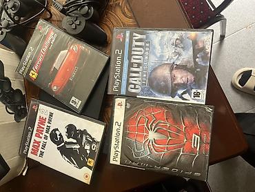 ps1 oyun: PlayStation 2 Slim komplekti Məzmun: - 2 ədəd Sony PlayStation 2 Slim — 2