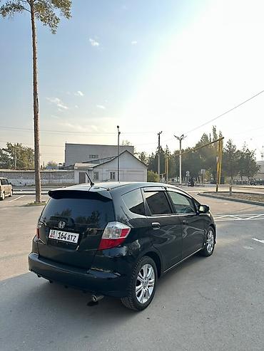 самое бортовой: Honda Fit: 2009 г., 1.5 л, Автомат, Бензин, Хэтчбэк — 6