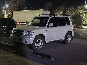 эвакуатор озгон: Mitsubishi Pajero iO: 2003 г., 2 л, Автомат, Бензин, Жол тандабас — 3