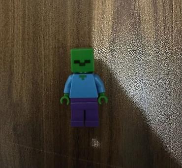 oyuncaq maşin: LEGO® Minecraft minifiqur – yaşıl kvadrat başlı, pikselvari gülümsəyən — 1