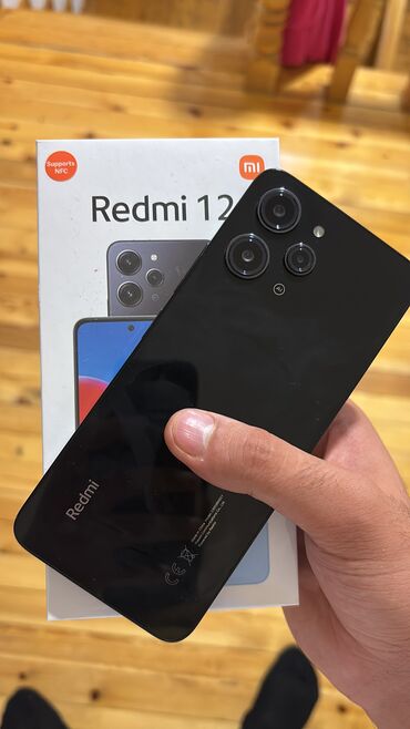 nomre axtarisi: Redmi 12, 128 GB, rəng - Qara, Sensor, Barmaq izi, İki sim kartlı