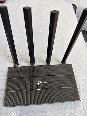 wifi extender: Маршрутизатор TP-Link с четырьмя внешними антеннами. Основные — 1