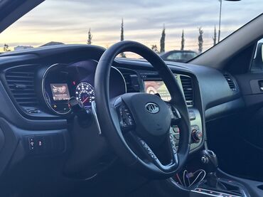 Kia: Kia Optima – ağ rəngli, zərif sedan Xarici xüsusiyyətlər: - Aqressiv — 13