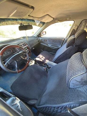 385 55: Mazda 626: 1997 г., 1.8 л, Механика, Газ, Седан — 9
