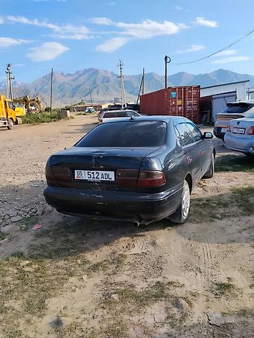 короми: Toyota Carina E: 1999 г., Бензин, Седан — 1
