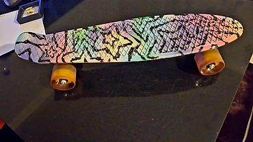 skeyt board: Rəngarəng dizaynlı penny board/skateboard. - Gövdə: Sürüş zamanı — 1