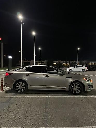 sonata fara: Kia Optima sedan kuzalı avtomobildir. Şəkillərdə avtomobil gümüşü — 3