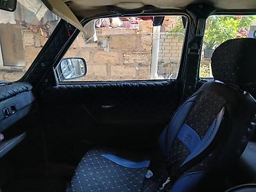 lada diskləri: LADA Niva 4x4, mavi rəng, 5 qapılı universal kuzov. Xüsusiyyətlər: - — 9
