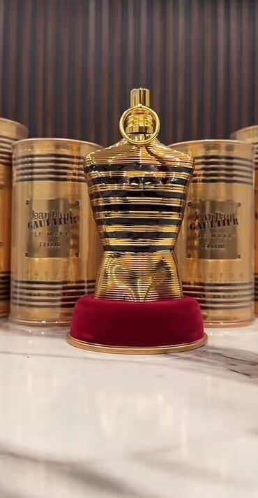 Ətriyyat: Jean Paul Gaultier Le Male Elixir ətrinin qızılı rəngli, zolaqlı
