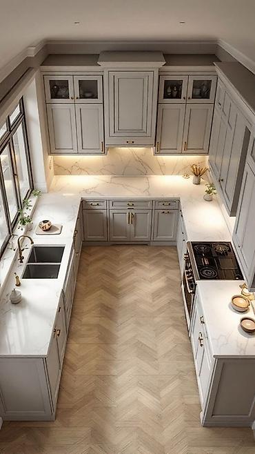 Кухонные гарнитуры: Кухонный гарнитур в современном стиле, выполненный в светлых тонах. Он — 5