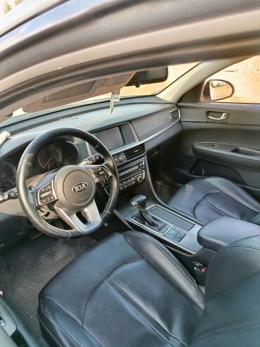 купить опель вектра с 2.2 бензин: Белый седан Kia Optima с динамичным дизайном. Автомобиль оснащен