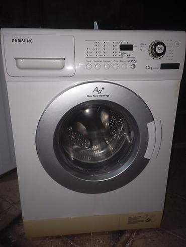 display: Samsung paltaryuyan maşın, ön yükləməli model. Korpus üzərində 6.0 kq — 1