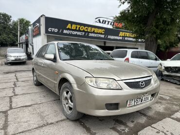 купить фары хелла блек на бмв е34: Mazda Familia: 2002 г., 1.5 л, Механика, Бензин, Хэтчбэк