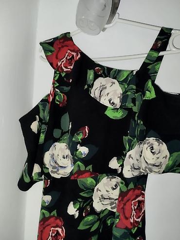 ara torbe: Ženska midi haljina s floralnim printom - Model: kroj u obliku slova — 1