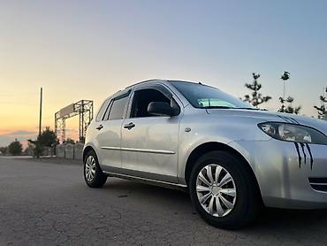 мата секыл: Mazda 2: 2003 г., 1.3 л, Кол менен иштөөчү, Бензин, Хетчбек — 2