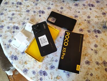 telefon kabrolari: Poco X5 Pro, 256 GB, rəng - Qara, Zəmanət, Sensor, Simsiz şarj