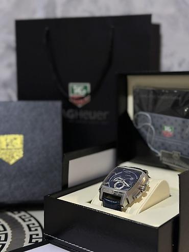 Qol saatları: TAG Heuer qol saatı – Monaco dizaynlı kvadrat korpus Xüsusiyyətlər: - — 1