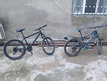 velosiped tutacağı: Məhsul: 2 ədəd dağ velosipedi 1) Qara velosiped - Rəng: mat qara - — 2