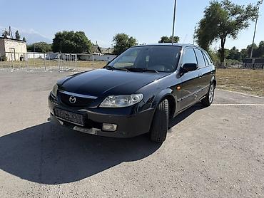 Транспорт: Mazda 323: 2002 г., 1.6 л, Механика, Бензин, Хэтчбэк — 7