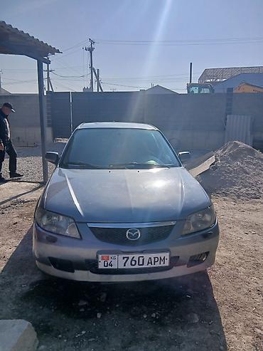 пф 021: Mazda 323: 2003 г., Механика, Бензин, Универсал — 2