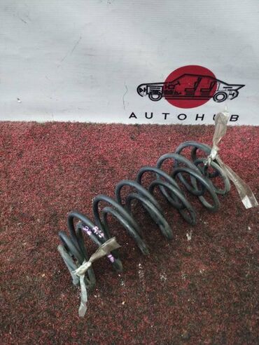 амортизатор на гольф3: Пружина Mazda Demio DY3W 1300 2003 задн. (б/у)