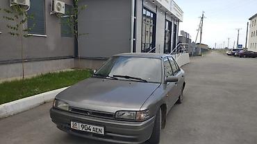Транспорт: Mazda 323: 1990 г., Седан — 4