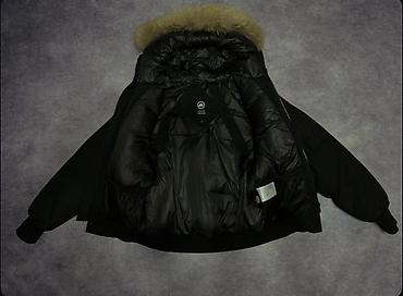 пух: Canada Goose — зимняя куртка-пуховик с меховой опушкой - Модель — 3