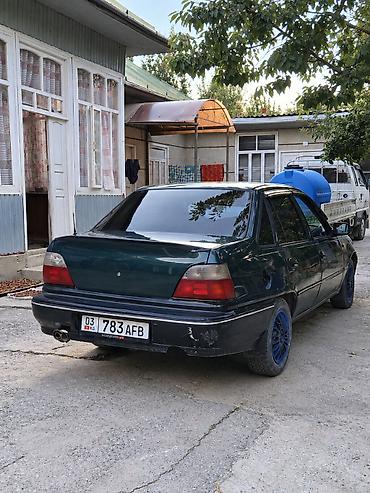 новые авто в бишкеке: Легковой седан темно‑зеленого цвета с черным обвесом и тонированными — 2
