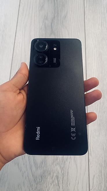 Мобильные телефоны: Смартфон Redmi 13C (модель на экране устройства), цвет черный — 3