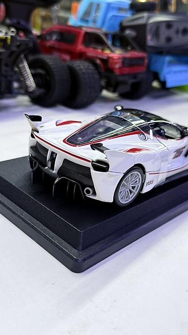 минако фокс: Модель автомобиля Ferrari FXX K от Bburago. - Масштаб: 1:18 (на — 3