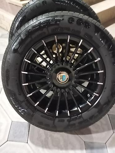 vaz disk: Məlumat: - 4 ədəd təkər diski və şin komplekti - Disklər çoxşaxəli — 9