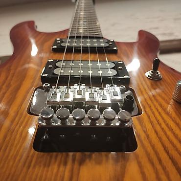 ukulele: Elektro-gitara Smiger L-G7 Simlərin sayı: 6 Üst: Söyüd aəacı Qol — 2