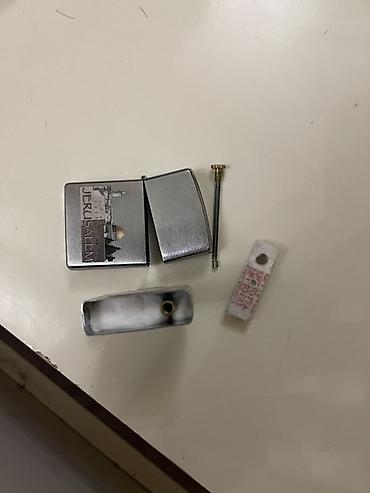 ziyafet donu vilyur s: Təptəzədir təkcə qabı yoxdur orjinaldır Məhsul: Zippo benzinli alışqan — 2