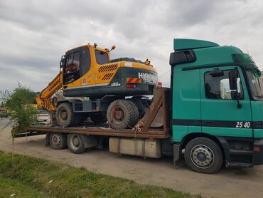 Услуги эвакуатора: С прямой платформой, С ломаной платформой, С частичной погрузкой — 4