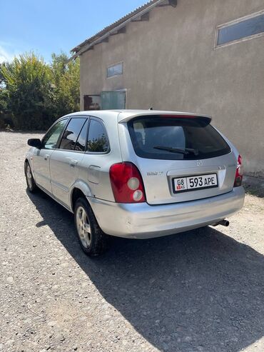 машине алам: Mazda 323: 2003 г., 1.6 л, Механика, Бензин, Хетчбек